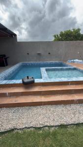 a large swimming pool with steps at Rancho Helena in Maceió