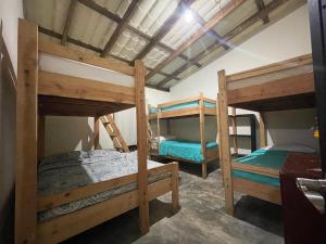 a bedroom with two bunk beds in a room at Arroyo Frío River Lodge in Arroyo Frío