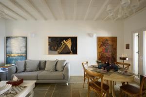 a living room with a couch and a table at GL Villa in Agios Romanos