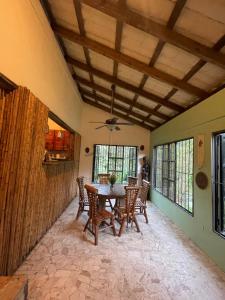 a dining room with a table and chairs at Arroyo Frío River Lodge in Arroyo Frío +14 photos