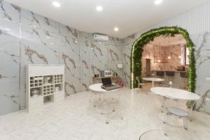 a room with two tables and an arch at Guest House Partenope in Naples +100 photos