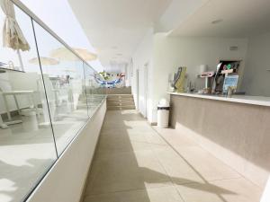 a long hallway with a counter at BLUESEA Lagos de Cesar in Puerto de Santiago