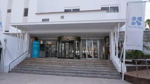 a white building with stairs in front of it at BLUESEA Anba Romaní in Cala Millor