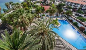 an overhead view of a resort with a pool and palm trees at BLUESEA Interpalace in Puerto de la Cruz +15 photos