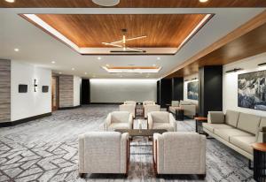 a lobby with a waiting room with couches and chairs at Hotel Alpenrock Breckenridge, Curio Collection by Hilton in Breckenridge