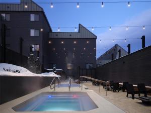 a swimming pool in the middle of a building at Hotel Alpenrock Breckenridge, Curio Collection by Hilton in Breckenridge