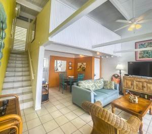 a living room with a couch and a table at Tropical Oasis in Christiansted