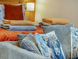 a living room with two couches and pillows at 1 Bed in Llangammarch Wells oc-bn216 in Garth