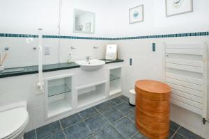 a white bathroom with a sink and a toilet at 2 Bed in Reef oc-r30133 in Uig