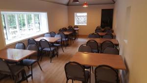 an empty room with tables and chairs and a window at Secluded Seven Room House in Okehampton