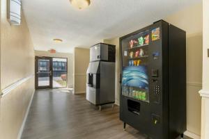 a room with a vending machine and a refrigerator at Red Roof Inn Lumberton in Lumberton
