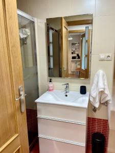a bathroom with a sink and a mirror at Can Rios-Felechosa - Aller in Felechosa +34 photos
