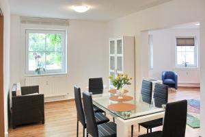 a dining room with a table and chairs at Lilie in Lübbenau