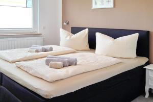 a bed with two pillows on top of it at Dobra in Lübbenau