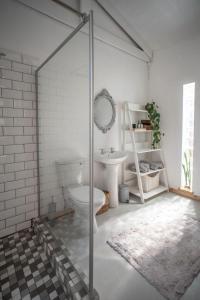 a bathroom with a toilet and a sink at Parmant in Robertson
