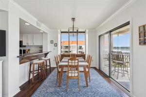 a kitchen and dining room with a table and chairs at 261 Captains Quarters in Hilton Head Island