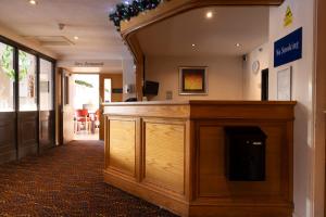a courtroom with a wooden podium in a building at Weathervane Hotel by Greene King Inns in Stoke on Trent