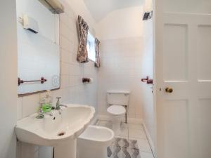 a white bathroom with a sink and a toilet at 3 Bed in Bruree oc-i207 in Brú Rí +12 photos