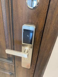 a door with a lock on a wooden door at Байсанат 2 in Karagandy