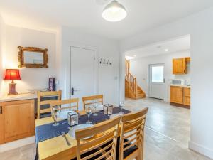 a dining room with a table and chairs at 3 Bed in Roundstone oc-i234 in Callow