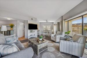 a living room with a couch and a table at 201 Captains Quarters in Hilton Head Island