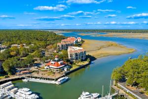 an aerial view of a marina with boats docked at 201 Captains Quarters in Hilton Head Island