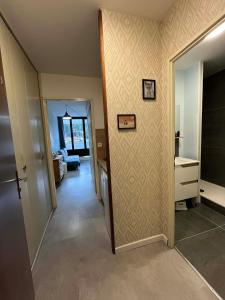 a hallway of a house with a room with a bedroom at L'ourson B2 in La Bresse