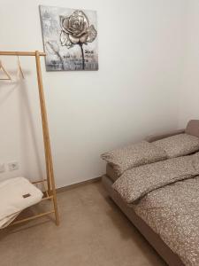 a bedroom with a bed and a picture on the wall at Villa Elmiso Sarajevo in Sarajevo +23 photos