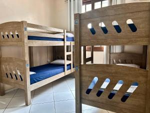 a room with two bunk beds in a room at Hostel Mar in São Luís