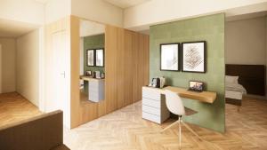 a room with a desk with a chair and a bed at Vivere Hotel in Catania