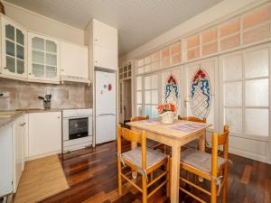 a kitchen with a table and chairs in a room at Acropol Seaview Apartment in Corfu Old Town by the Old Port in Corfu