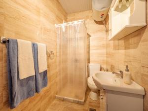 a bathroom with a shower and a toilet and a sink at Acropol Seaview Apartment in Corfu Old Town by the Old Port in Corfu