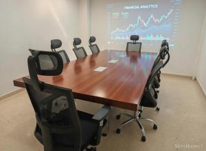 a conference room with a large wooden table and chairs at Hotel Murahno Collection in Cúcuta