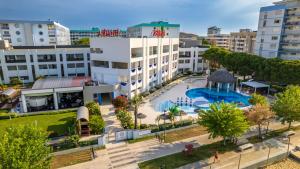 an aerial view of a city with a swimming pool at Ashanti Aparthotel Wellness&Spa in Bibione