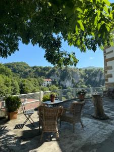 a patio with chairs and a table with a view at Goiko-Benta Ostatua in Oñati