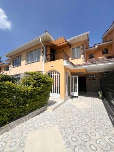 a house with a driveway in front of it at Crystal Luxury Palace in Nairobi
