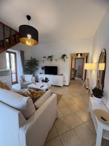a living room with a couch and a tv at A casa di Maria in Sulmona