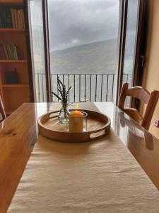 a candle sitting on top of a table with a view at Capileira Luz de Sierra in Capileira +11 photos