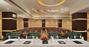 a large conference room with a table and chairs at Best Western Maryland in Chandīgarh