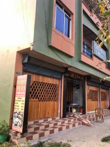 a building with a sign in front of it at Hotel Moonlight and Lodge in Birtamod