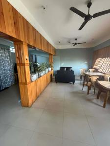 a living room with a couch and a table at Hotel Moonlight and Lodge in Birtamod