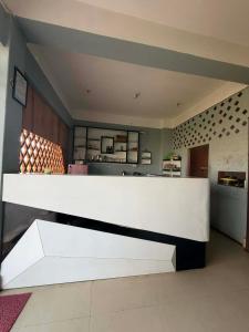 a white counter in a room with a kitchen at Hotel Moonlight and Lodge in Birtamod