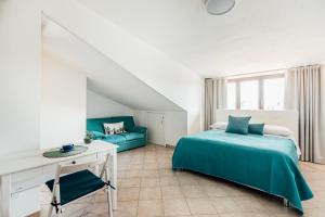 a bedroom with a bed and a couch at Da Micchele Rooms in Vasto +57 photos