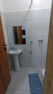 a bathroom with a sink and a toilet and a shower at Imperial cabins in Nyeri