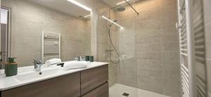a bathroom with a sink and a shower at Les Chalets d'Offaz - Centre Abondance - Alp'in C in Abondance