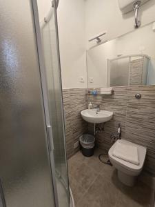 a bathroom with a toilet and a sink at Albergo Sonia in Florence +33 photos