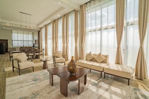 a living room with a couch and chairs and a table at The 67 Escape, Elementaita in Gilgil