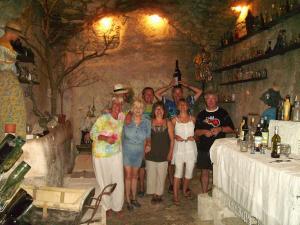 a group of people posing for a picture in a bar at La Maison du Chichui in Orgon