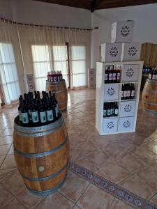 a room with barrels of wine on display at Hotel Rural La Marmita de Ahlam in Fondón