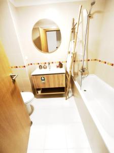 a bathroom with a sink and a mirror at Art House Madeira II in Caniço +27 photos